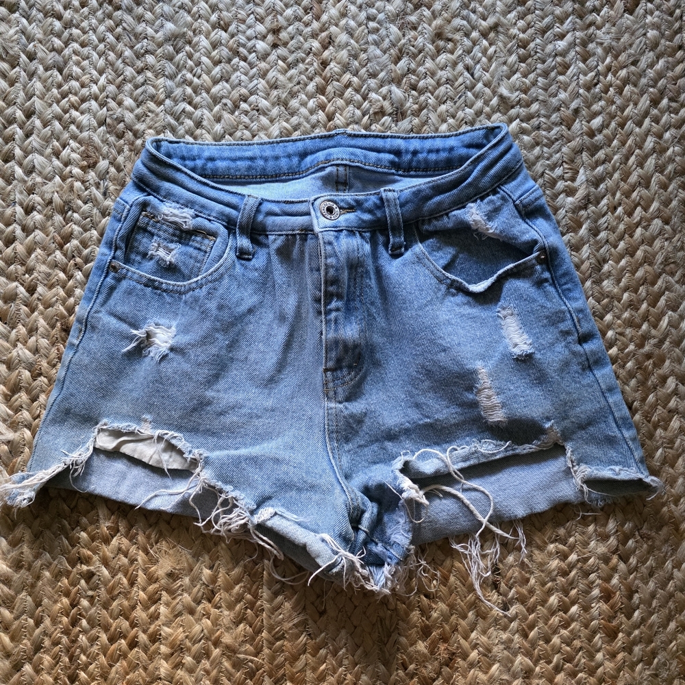 Flirty High Waisted Light Blue Distressed Jean Shorts